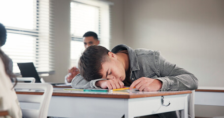 Poster - Tired, school and boy in classroom at desk with fatigue for writing assignment, test and quiz. College, university and exhausted student sleeping for learning, education and bored in lesson on campus