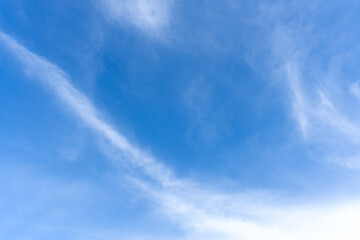 low angle view and full frame of beautiful blue sky with strange shape of thin white clouds in the m