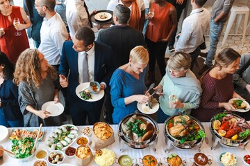Wall Mural - diverse group at a buffet, enjoying food and conversation. people mingling, eating, and socializing 