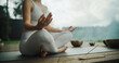 © Gorodenkoff - Anonymous Female Sits Cross-Legged, Meditating in a Nature Retreat, Blending with Peaceful Forest Surroundings. Incense Gives Soothing Aromas, while the Harmonious Tones of Singing Bowls Resonate