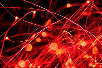Wall Mural - abstract red light trails and bokeh effect on a dark background