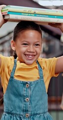 Poster - Smile, child and books on head in library for knowledge, literacy and information on project. Happy, student and walk with novel for academic reading, literature development and studying for learning