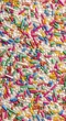 © scrdy - Colorful Sprinkles Sugar Pearls White Background Closeup Confectionery Topping Dessert Food