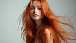 © Vadym - Studio beauty shot young woman with long silky red ginger hair. Model with freckles, vibrant style, healthy skin. Hair product advertisement. Hair care treatment, cosmetic concept.