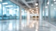 © El Media - Blurry Hallway Perspective in a Modern Office Building Interior