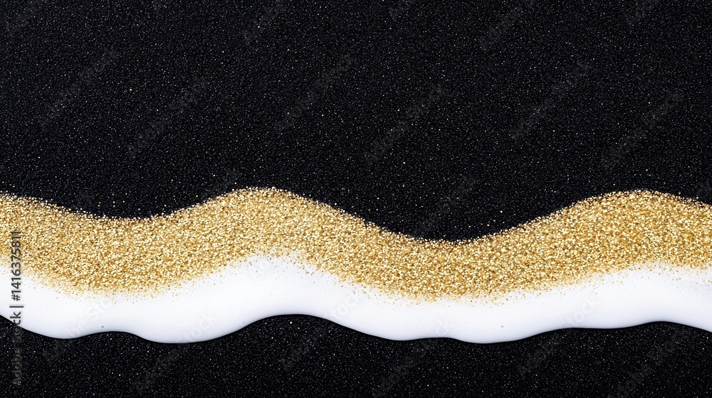 A captivating image featuring a wavy line of golden glitter on a smooth white surface, contrasted against a dark background.