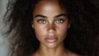 © PT CINTA SEJATI - Close-up portrait of a woman with stunning features.  Natural beauty, healthy skin, and expressive eyes.  Curly dark hair frames her face