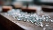 © VK Studio - Sparkling glass shards scattered across a workbench glisten in soft light, highlighting the delicate beauty of craftsmanship and creation.