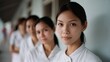 © VK Studio - Portrait of nurses in line, the foreground woman exudes calm professionalism, reflecting quiet dedication in a healthcare environment.