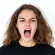 © BaiBoon88 - Angry young woman screaming closeup studio background emotion portrait high tension scene