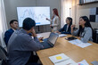 © Freeday photo - Professionals engaged in a financial presentation with data analysis in a modern conference room setting