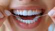 © Dmitry - Flossing between teeth promotes dental health and prevents plaque buildup, ensuring brighter smiles and healthier gums
