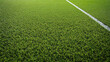 © Mauricio - Close up of green artificial grass turf with white line for sports field background texture