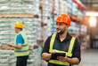 © tai - caucasian warehouse worker checking using tablet. caucasian man wearing safety examine storage area with touch screen document. supervisor wear helmet safety vest at workplace inspect stock by tablet