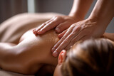 Close-up of hands performing a back massage, oil glistening on skin, showcasing relaxation and wellness, ideal for spa or massage therapy