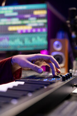 Leinwandbilder - Audio engineer mixing and mastering music on daw software interface, creating cool modern tunes with acoustics and equalizer. Artist recording songs on soundboard panel in his home studio.