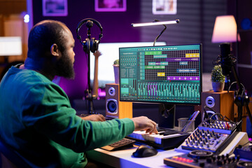Leinwandbilder - Artist playing electronic piano keyboard notes and recording audio files to use mix and master techniques, editing recordings to edit sound effects. Musician composer operating on synthesizer gear.