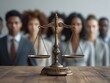 © Imagine  - Close-up of justice scale with diverse group of people in background, highlighting fairness, inclusion, democracy, and decision-making in legal system