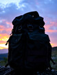 © Sara - A rugged militarystyle backpack against a dramatic sunset