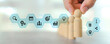 © Jintana - Hand chooses wooden person stands with HR human resources icons for personal leader training skill or leadership and challenge business team player and organization management teamwork