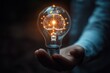 © app - Person touching glowing brain lightbulb symbolizing creativity innovation and new ideas in technology and business