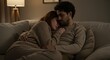 © AleniaFlow - Couple Embracing on a Sofa at Night