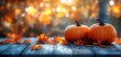 © Tatyana - autumn pumpkins dried leaves rustic wooden table golden hour thanksgiving fall seasonal decoration