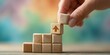 © Khamidhilal - Wooden blocks forming a stairway with an upward arrow symbol, symbolizing progress and growth