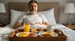 © AleniaFlow - Middle Aged Man Enjoying Breakfast in Bed
