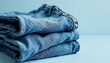 © Sarayuth - Classic light wash denim jeans, folded neatly , apparel, product shot, garment