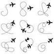 © firoz - Airplane line path travel line icon set. Airplane path in dotted line shape. Airplane routes set. Romantic travel, heart dashed line trace and plane routes Vector Black silhouettes.