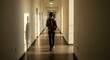 © Ihsanfrr - Student Walking Down Hallway - Photo