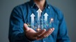 © Mia - Process to increase productivity concept. Businessman holding productivity icon with growth graph for industrial management in efficiency and efficient process. Lean cost and productivity growth.