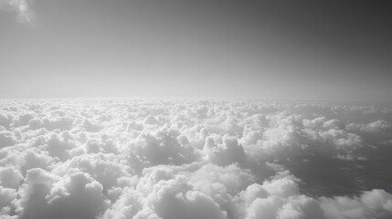 Wall Mural - A grayscale aerial view depicting expansive cloud formations and open skies