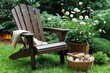 © kornc - Relaxing outdoor setting wooden adirondack chair with flowers and stones garden photography tranquil viewpoint nature concept