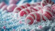 © rasya - Candy canes on snow with pink candies blurred in background for holiday theme