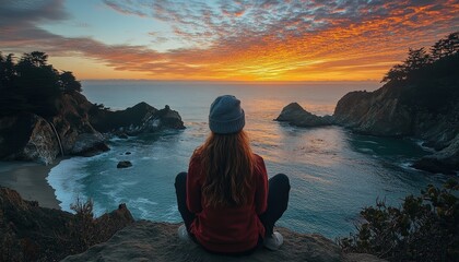 Poster - Sunset over calm ocean waters with cliffs and grassland along the shore at a scenic coastal location