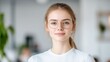 © KUTIL KURO - Young Woman with Glasses Minimalist Portrait Soft Lighting Close-up Shot Neutral Expression Bright Office Background Calm Serene Mood Ideal for Professional Profiles