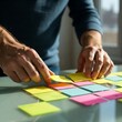 © organik - business people post it notes in glass wall at meeting room