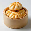 © Throm-Ka - Freshly Baked Bao buns on a white background