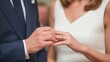 © Pro Hi-Res - Couple exchanges wedding rings during intimate ceremony in a beautifully decorated venue just after sunset.