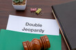 © Kamitana - A partially revealed document marked Double Jeopardy rests next to a judge’s gavel—emphasizing judicial limitations and constitutional justice principles.