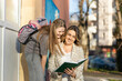 © Dejan - A girl and woman share excitement while reading a book, illustrating a joyful connection and the power of shared experiences.