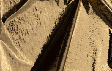 Aufkleber - Golden foil sheet with reflective, shiny texture, creating a radiant, high-contrast background. Crumpled, metallic fabric design with glitter and shimmer, perfect for elegant cards, modern decor, and.