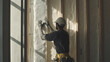 © bussi - Construction Worker Applying Insulation Foam