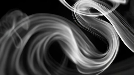 Wall Mural - abstract smoke trails on black background