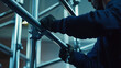 © Bhait - Worker Assembling Metal Scaffolding