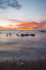 Wall Mural - beautiful scenic sunset view on a calm beach.