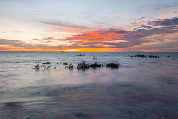 Wall Mural - beautiful scenic sunset view on a calm beach.