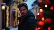© Yana - Man in winter coat amidst festive lights during the holiday season outdoors